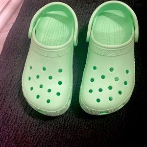 Mint green crocs